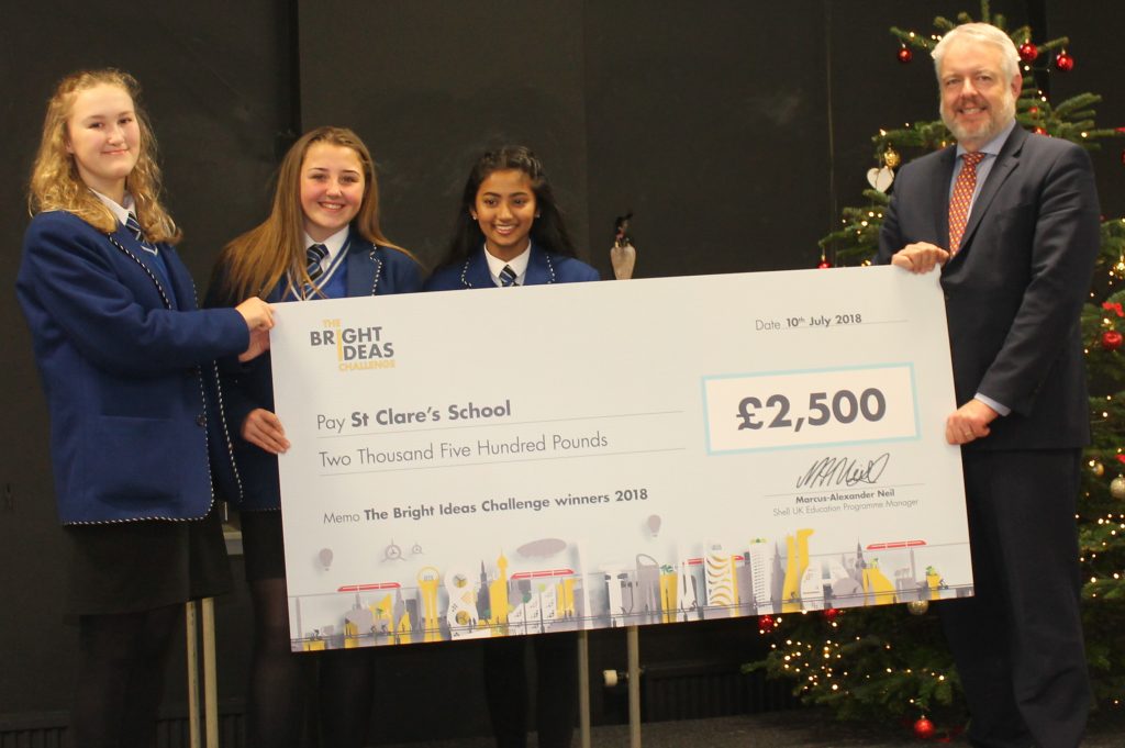 team with cheque and Carwyn Jones